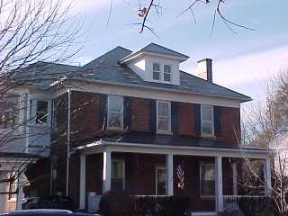 Virginia black roof on brick siding