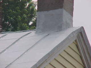 Roofin work by Roof Menders flashes chimney, encapsulating all previous repair work