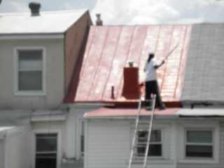 Row house roof with leakage problems, resolved by Roof Menders