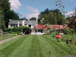 Roof Menders applied a green coating, changing roof from red to green