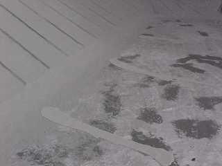 Roof Mender crew members know how to measure amount of coating needed to install fully reinforced system