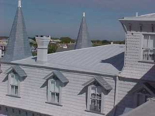From a distance the roof appears compled with a tin roof repair