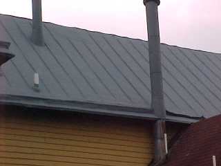 Stacks are coated with the same slate grey acrylic from Andek Corporation