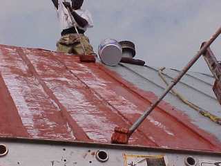 By brush mesh is embedded into wet base coating