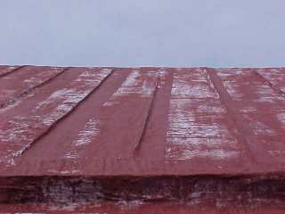 Closeup of foundation work that weatherproofs the roof and mutes the imperfections.