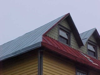 Grey primer over some of the roof