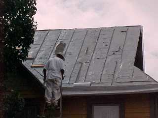 <br>
Crew chief inspecting work by his Roof Menders crew members