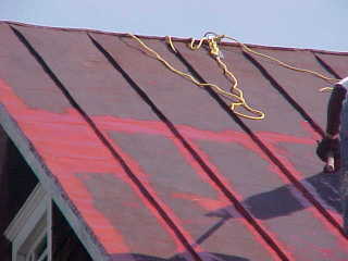 Historic roof restoration starts with cleaning and priming