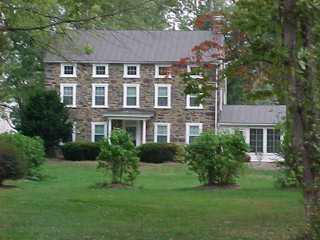 Bronze color roof over stone house