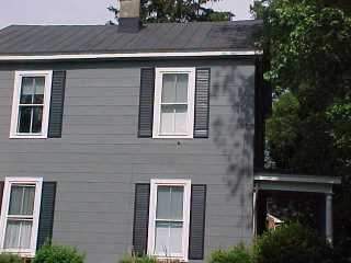 Roof, shutters and siding with white trim 